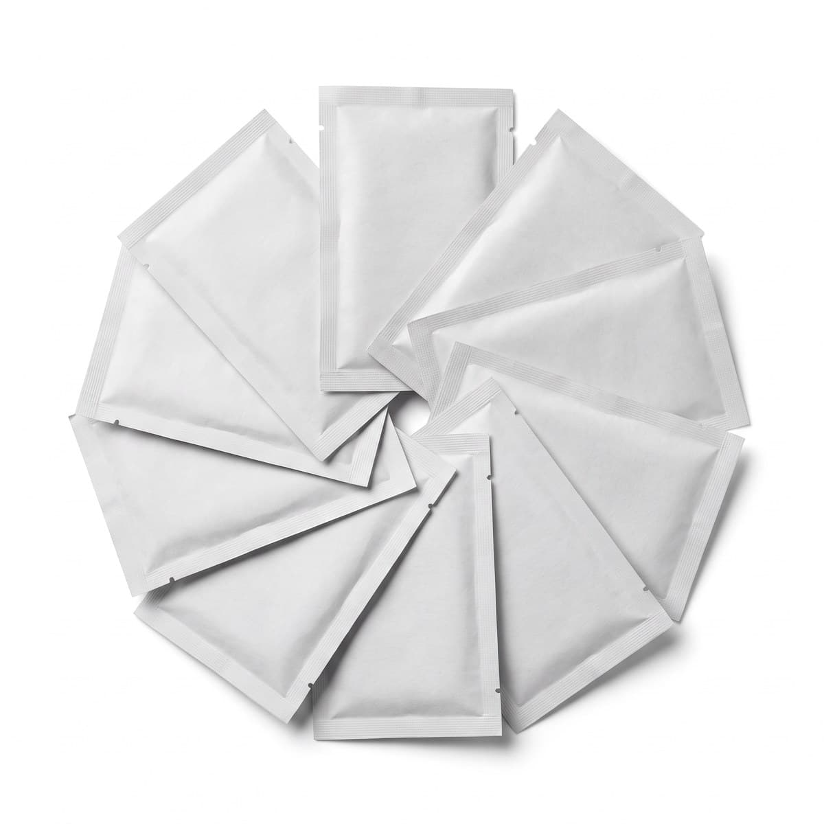 Several sealed air-activated hand-warmer packets fanned out