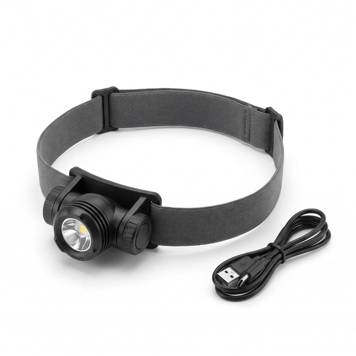 A black headlamp with a grey elastic strap and a tilting lamp head, with a USB-C cable beside it